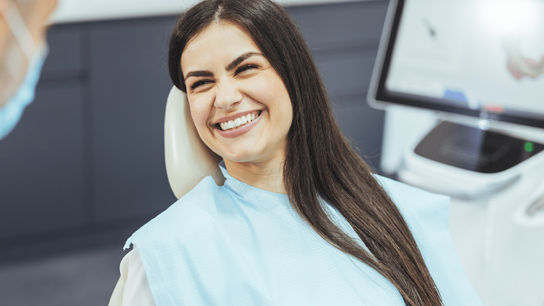 Lady Smiling In Chair